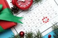 Flat lay composition with calendar and gift on light blue background. Boxing day concept Royalty Free Stock Photo