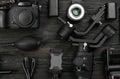 Flat lay composition with camera and video production equipment on black wooden table Royalty Free Stock Photo