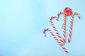 Flat lay composition with candy canes and lollipop Royalty Free Stock Photo