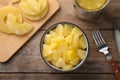 Flat lay composition with canned pineapple on table