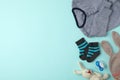 Flat lay composition with child`s clothes and accessories on blue background, space for text Royalty Free Stock Photo