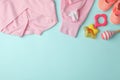 Flat lay composition with child`s clothes and accessories on blue background, space for text Royalty Free Stock Photo