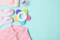 Flat lay composition with child`s clothes and accessories on blue background, space for text Royalty Free Stock Photo