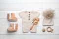 Flat lay composition with child`s clothes and accessories on white wooden table Royalty Free Stock Photo