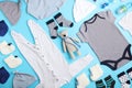 Flat lay composition with child`s clothes and toy bear on blue background Royalty Free Stock Photo