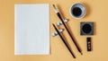 flat lay composition chinese ink with empty paper. High quality photo