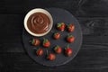 Composition with chocolate covered strawberries on wooden background Royalty Free Stock Photo