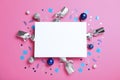 Flat lay composition of Christmas crackers, decorations, shiny confetti and blank paper on pink background. Space for text Royalty Free Stock Photo
