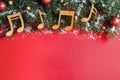 Flat lay composition with Christmas decor and music notes on red background Royalty Free Stock Photo