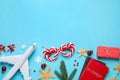 Flat lay composition with decorations and passports on light blue background, space for text. Winter vacation Royalty Free Stock Photo