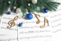 Flat lay composition with Christmas decorations and wooden music notes Royalty Free Stock Photo