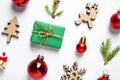 Flat lay composition with Christmas gift and festive decor Royalty Free Stock Photo