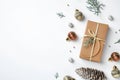 Flat lay composition with Christmas gift and festive decor on white background Royalty Free Stock Photo