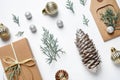 Flat lay composition with Christmas gift and festive decor on white Royalty Free Stock Photo