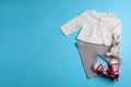 Flat lay composition with clothes and space for text on color background. Royalty Free Stock Photo