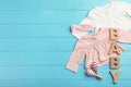 Flat lay composition with clothes and space for text on wooden background. Royalty Free Stock Photo