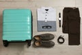 Flat lay composition with clothing and suitcase Royalty Free Stock Photo