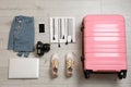 Flat lay composition with clothing and suitcase Royalty Free Stock Photo