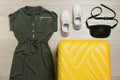 Flat lay composition with clothing and suitcase Royalty Free Stock Photo