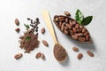 Flat lay composition with cocoa pod, beans and powder on table Royalty Free Stock Photo