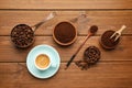 Flat lay composition with coffee grounds and roasted beans on wooden table Royalty Free Stock Photo