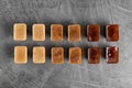 Flat lay composition with coffee ice cubes on grey background Royalty Free Stock Photo