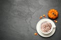 Flat lay composition of coffee with spider`s net latte art on grey table