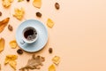 Flat lay composition with colorful Autumn cup of coffee and leaves on a color background. top view Royalty Free Stock Photo