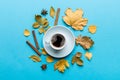 Flat lay composition with colorful Autumn cup of coffee and leaves on a color background. top view Royalty Free Stock Photo