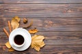 Flat lay composition with colorful Autumn cup of coffee and leaves on a color background. top view Royalty Free Stock Photo