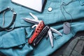 Flat lay composition with compact portable multitool and accessories on table Royalty Free Stock Photo
