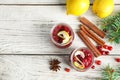 Flat lay composition with cranberry sauce in jars on white wooden background. Royalty Free Stock Photo