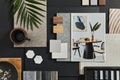 Flat lay composition of creative black architect moodboard with samples of building, textile and natural materials and personal.