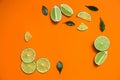 Flat lay composition with cut fresh juicy limes on background. Space for text Royalty Free Stock Photo