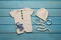 Flat lay composition with cute baby knitwear for photoshoot on light blue wooden background Royalty Free Stock Photo