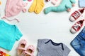 Flat lay composition with cute clothes and space for text on white wooden background. Royalty Free Stock Photo