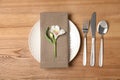 Flat lay composition with cutlery, plate and napkin