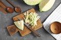 Flat lay composition with cutting board and chopped cabbage