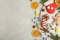 Flat lay composition with decorated Christmas biscuits and cookie cutters on light table. Space for text Royalty Free Stock Photo
