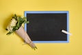 Flat lay composition of delicate beautiful stylish bouquet of asters flowers in craft wrapping paper tied with a rope on a blank