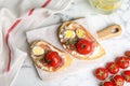 Flat lay composition with delicious bruschettas on marble table