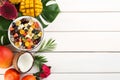 Flat lay composition with delicious exotic fruit salad on white wooden table. Space for text Royalty Free Stock Photo