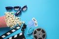 Flat lay composition with delicious popcorn on blue background Royalty Free Stock Photo