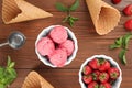Flat lay composition with delicious strawberry ice cream on wooden