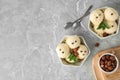 Flat lay composition with delicious vanilla ice cream and hazelnuts on table Royalty Free Stock Photo