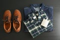 Flat lay composition with denim jacket, shirt, perfume and shoes