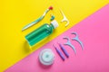 Flat lay composition with dental floss and different teeth care products on color background Royalty Free Stock Photo