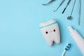 Flat lay composition with dentist tools and tooth