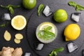 Flat lay composition with detox lemonade and ingredients on table Royalty Free Stock Photo
