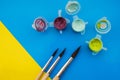 Flat lay composition with different acrilic or oil paints and brushes on grunge background Royalty Free Stock Photo